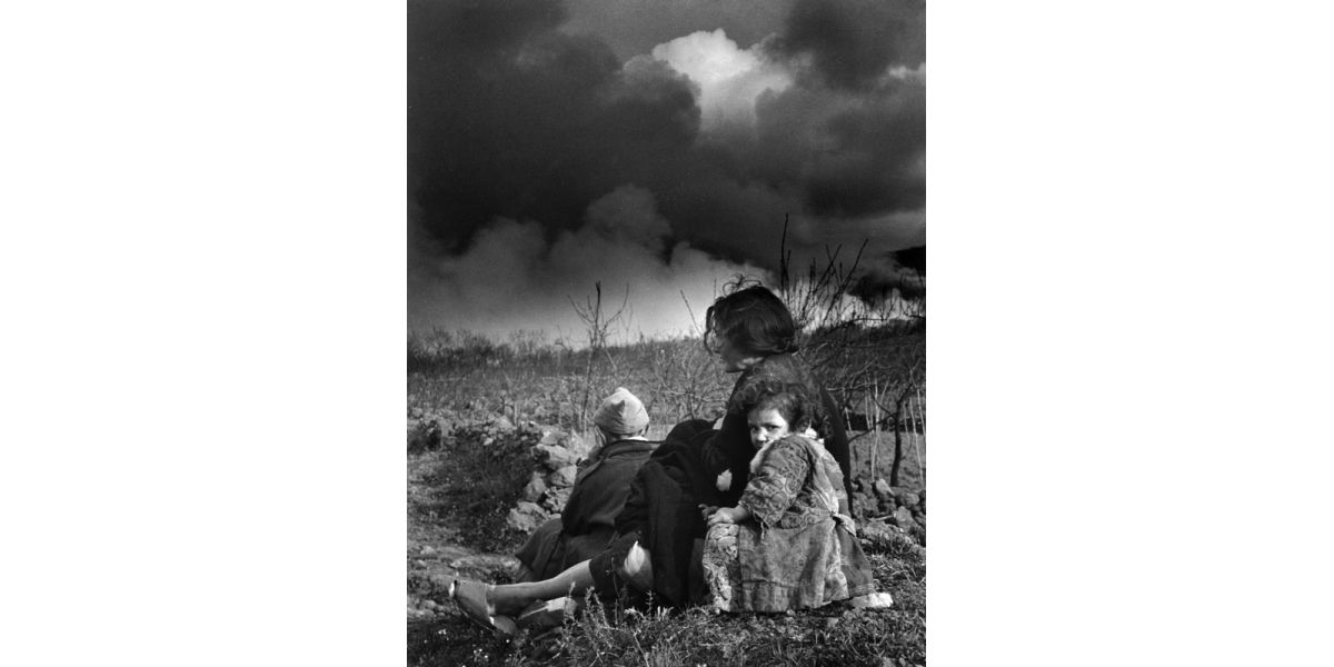 Unidentified author, Mother with worried children after the eruption of Vesuvius, in 1944, gelatin silver print on paper, 10x15 cm, Alinari Archives-album collection, Florence