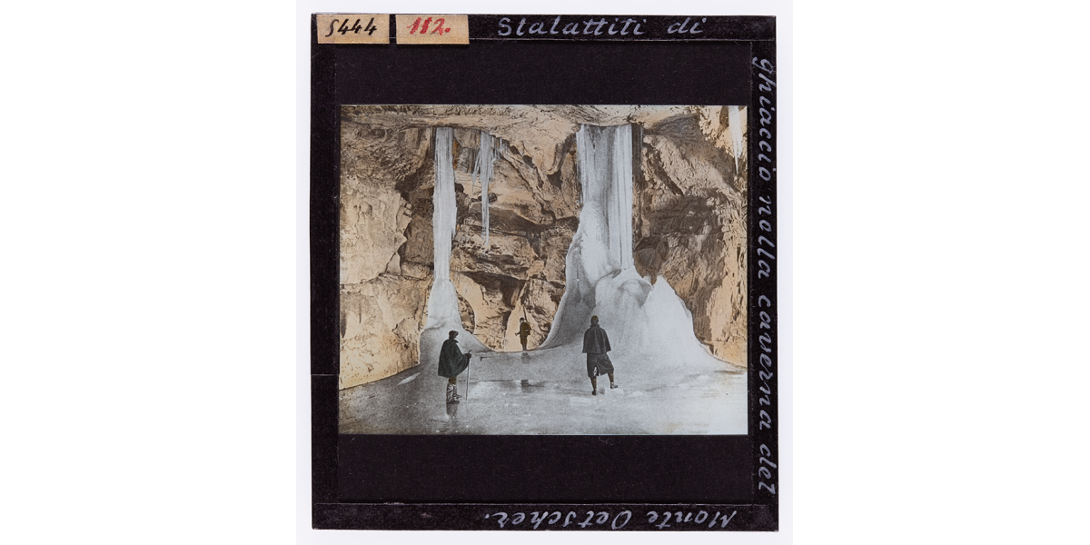 Giorgio Roster, Ice stalactites in the cavern of Mount Oetscher, hand-coloured glass slide, 8 x 9 cm, Alinari Archives, Roster archive, Florence
