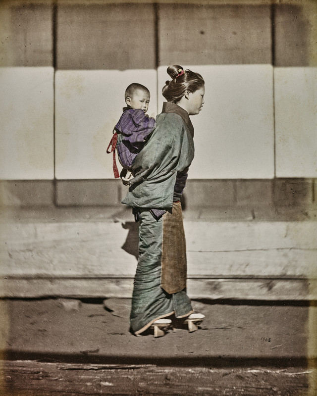 Felice Beato, Japanese woman carrying her son on her shoulders, 1868-1877, album mount, albumen, Alinari Archives, Florence.