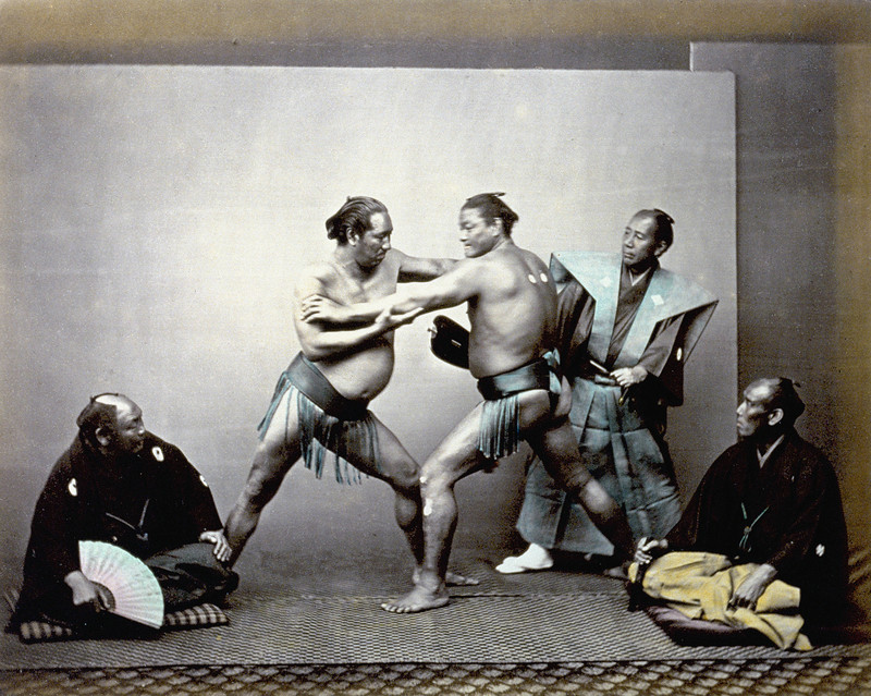 Felice Beato, Sumo wrestlers during a match, 1863-1868, print on double-weight paper, albumen, hand colouring, Alinari Archives, Florence.